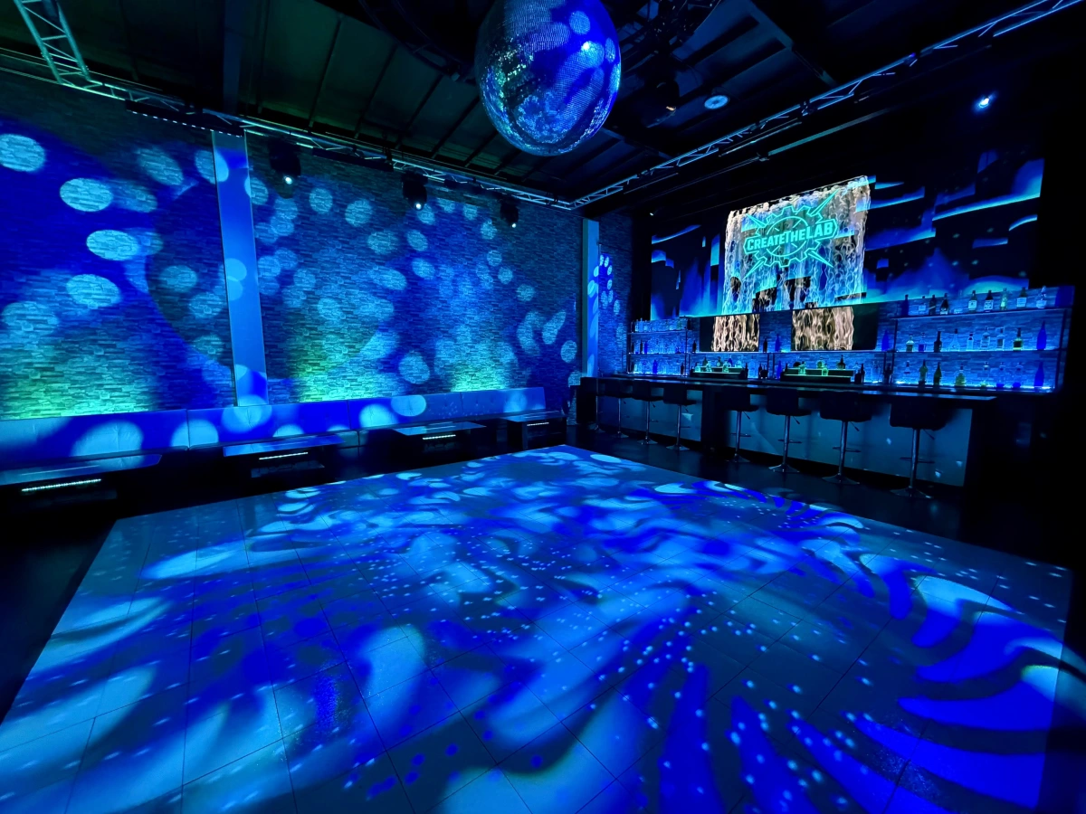 Create TheLAB former venue with custom blue lighting and LED displays
