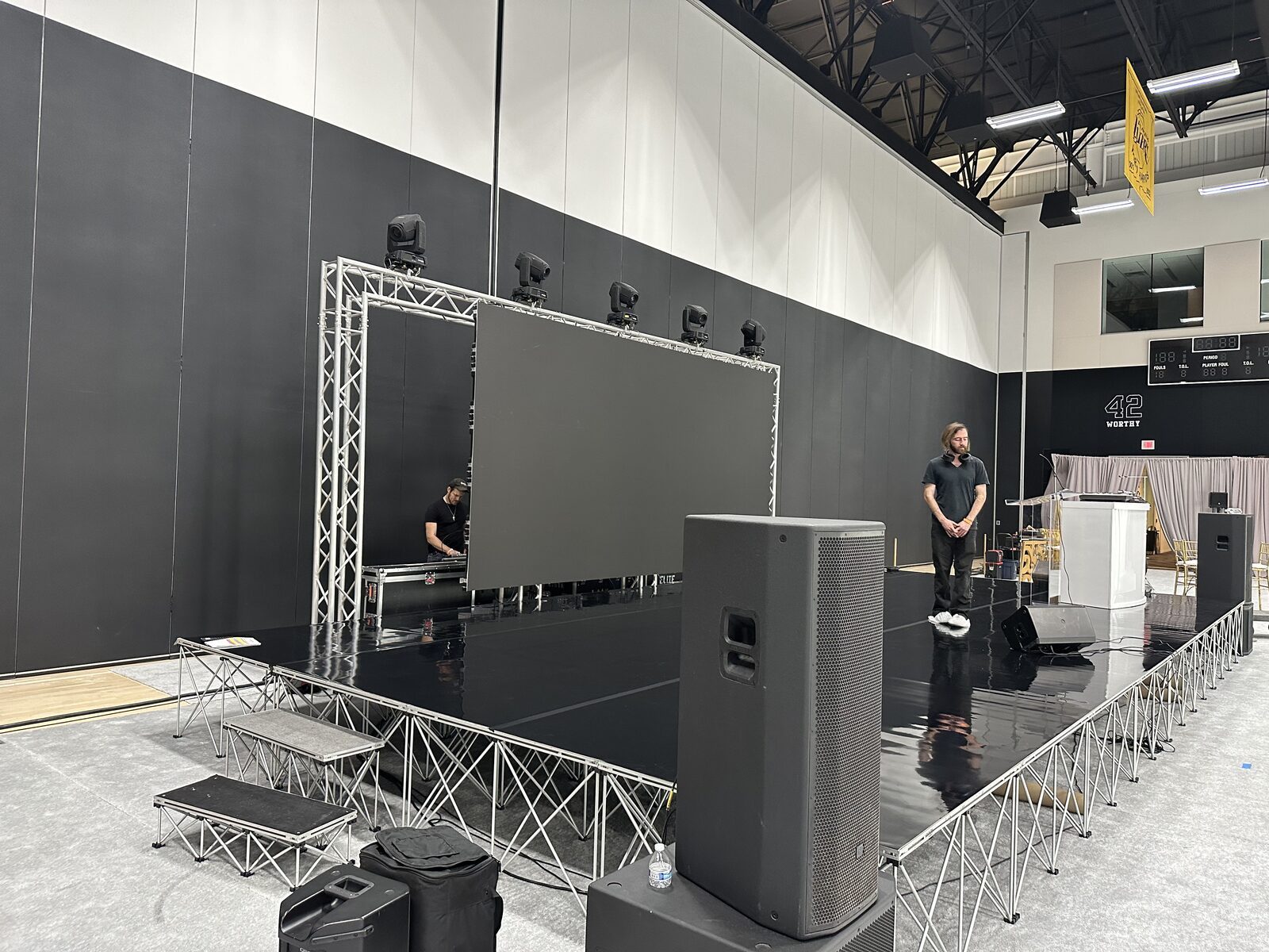 Audio and lighting checks before doors · In The Paint.