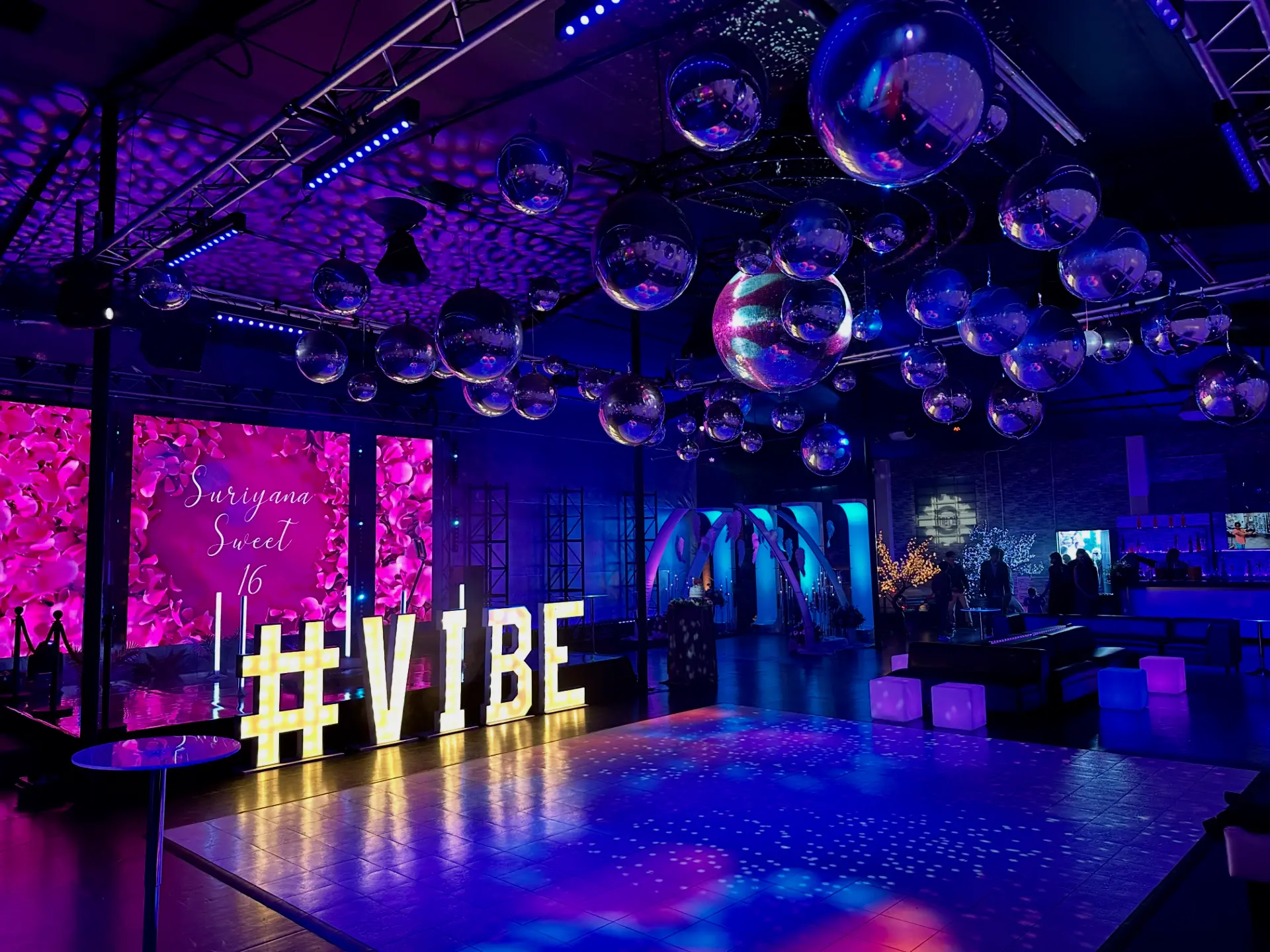 A celebration reimagined with LED walls, lighting, and a mirror-ball ceiling.