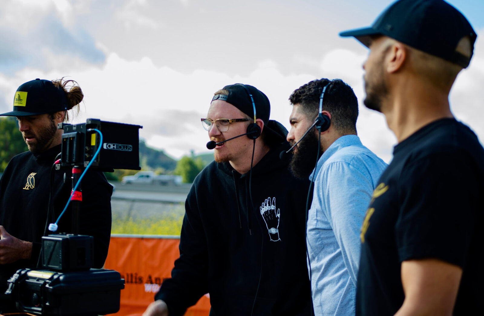 Crew monitoring the field broadcast on a camera monitor at the Annenberg Wildlife Crossing site.